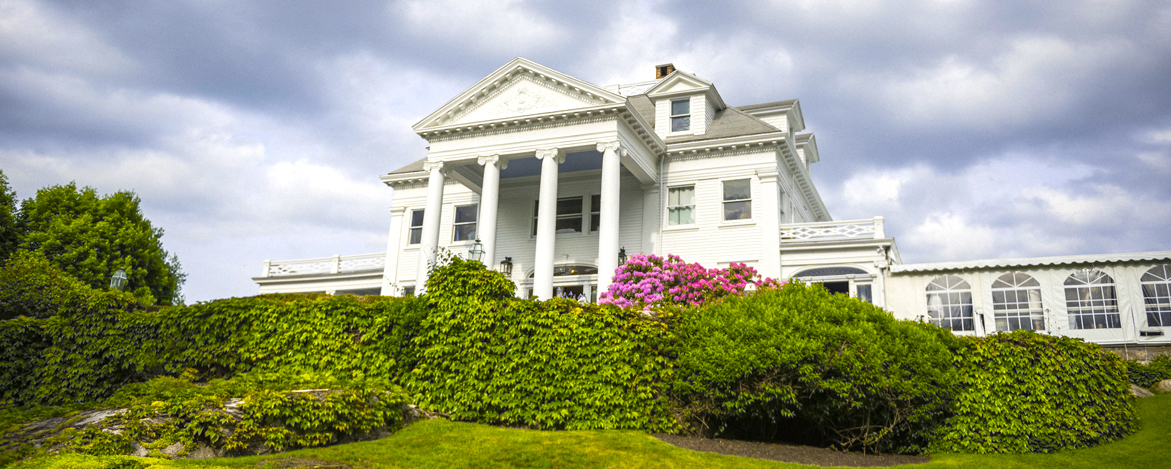 exterior of white building with tall columns in front